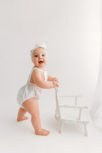 Baby girl in white outfit for Phoenix milestone session