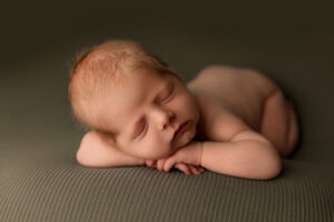 Newborn baby posing for newborn session