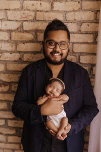 Dad holding baby for newborn session