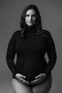 black and white editorial maternity session in Phoenix with mom wearing black bodysuit