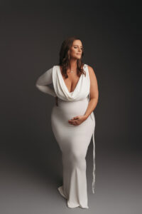 Mom posing in white  dress for editorial studio maternity portraits in Phoenix