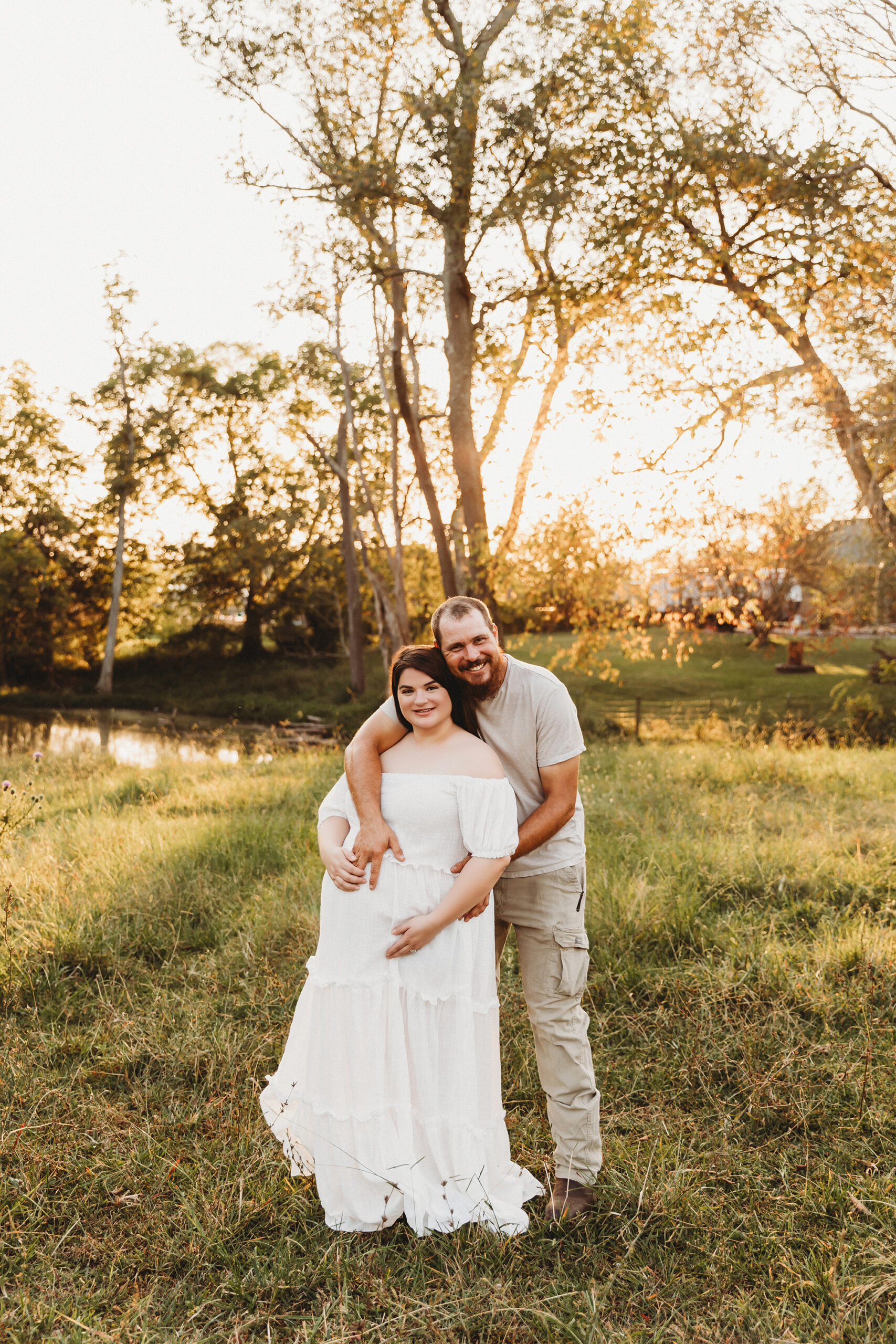 Mom and dad posing for maternity session