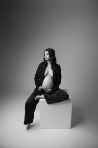 maternity portrait of woman in suit in phoenix maternity studio