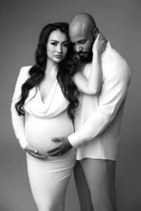 couple posing for black and white maternity portrait in phoenix