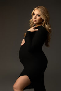 pregnancy pictures near me mom posing in black dress at phoenix maternity studio