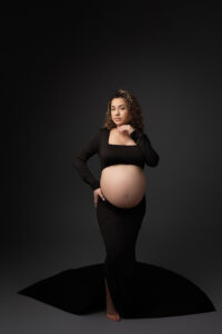 Mom wearing two piece maternity gown for studio maternity portraits in phoenix