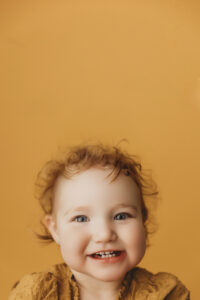 baby smiling in milestone portrait at phoenix portrait studio 