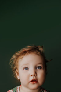 baby posing in milestone portrait at phoenix portrait studio 