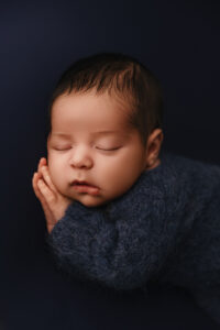 Baby posing for newborn session in Phoenix newborn photography studio