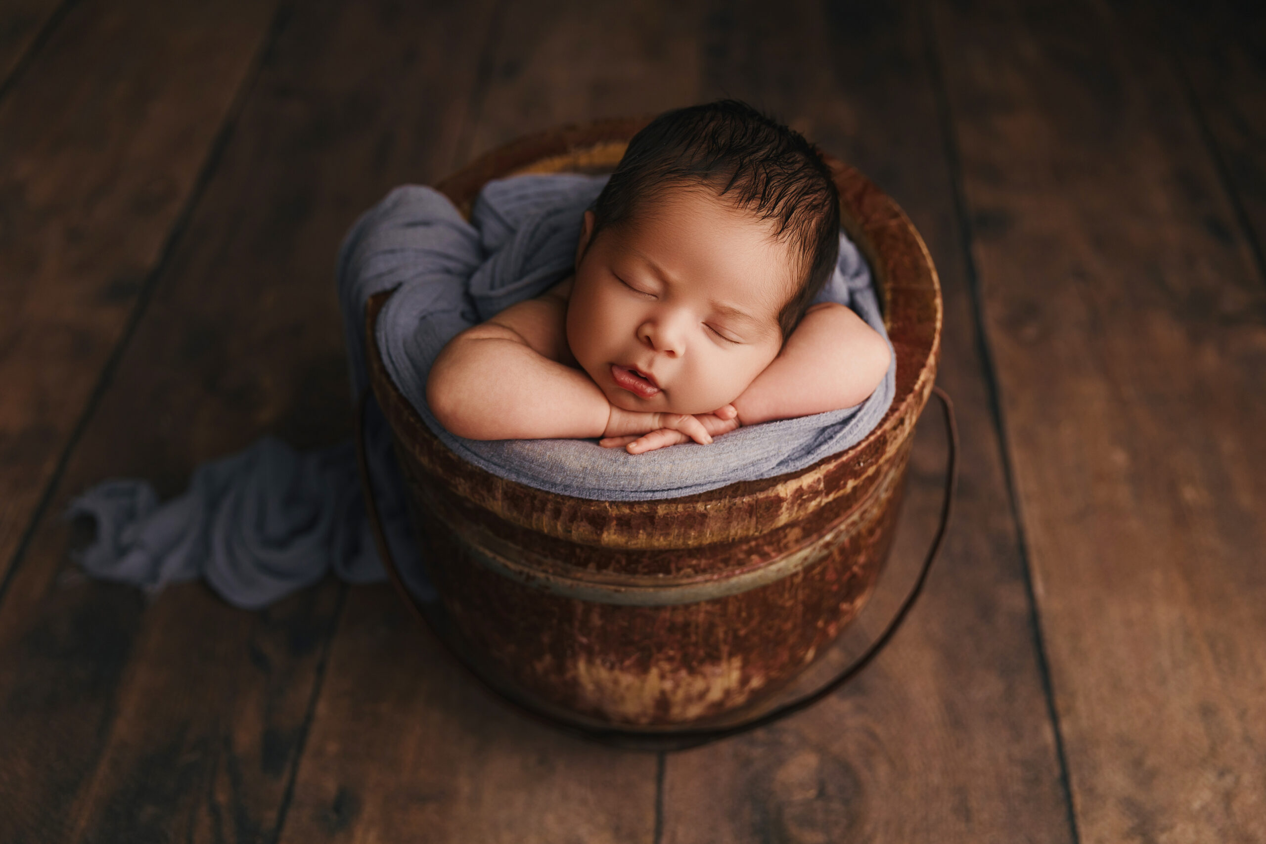 Baby posing for newborn session in Phoenix newborn photography studio. Infant portraits in Phoenix