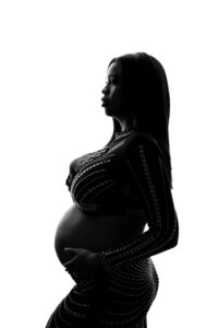 Black and white maternity portrait of black mom pregnant during pregnancy photoshoot in phoenix