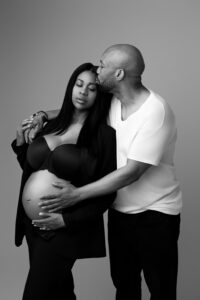 black couple posing for pregnancy photos in phoenix maternity portrait studio