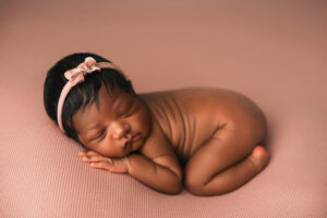 African American baby posing for newborn session at phoenix baby studio. Savings on Newborn & Maternity Photography