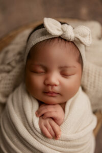 close up of newborn baby posing for baby portraits in Arizona