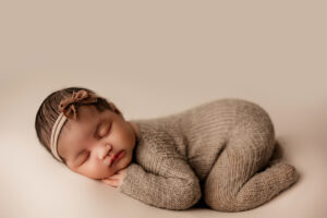 Newborn baby girl posing for newborn session in Phoenix newborn studio. 