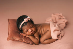 newborn baby posed for pictures at newborn studio