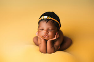 Black baby posing for newborn photography session in phoenix