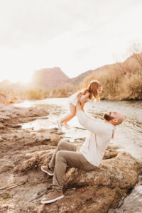 Experience a stunning sunset newborn and family photography session in Phoenix, capturing unforgettable moments at the Salt River. 