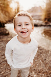 Little boy smiling during photography session at the salt river