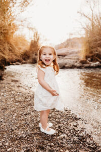 Experience a stunning sunset newborn and family photography session in Phoenix, capturing unforgettable moments at the Salt River. 