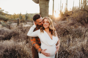 Phoenix Sunset Maternity Photoshoot with mom wearing a white dress from client closet