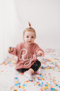 Baby during confetti mini session in Phoenix photography studio