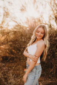 Girl with blonde hair in senior session at lost dutchman state park