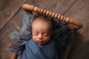 Black newborn baby posing for baby pictures in scottsdale