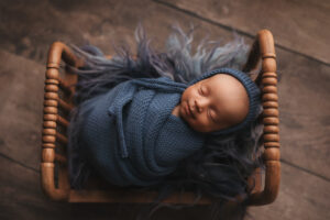 baby smiling for newborn photography session 