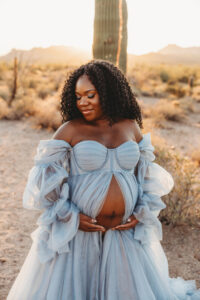 Destination maternity session at Superstition Mountains black mom in a blue dress 