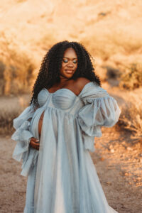 Destination maternity session at Superstition Mountains black mom in a blue dress 
