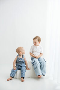 brothers in phoenix photography studio in jeans and white shirt