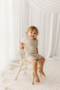 little boy posing for cake smash session in phoenix photography studio