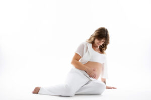 all white maternity picture session with white pants and white shirt in phoenix 