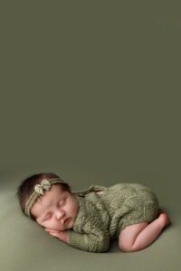 newborn girl in green outfit for phoenix newborn session