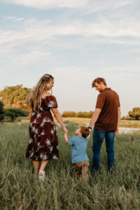 family of 3 wearing chocolate brown + blue in their photoshoot in arizona chandler