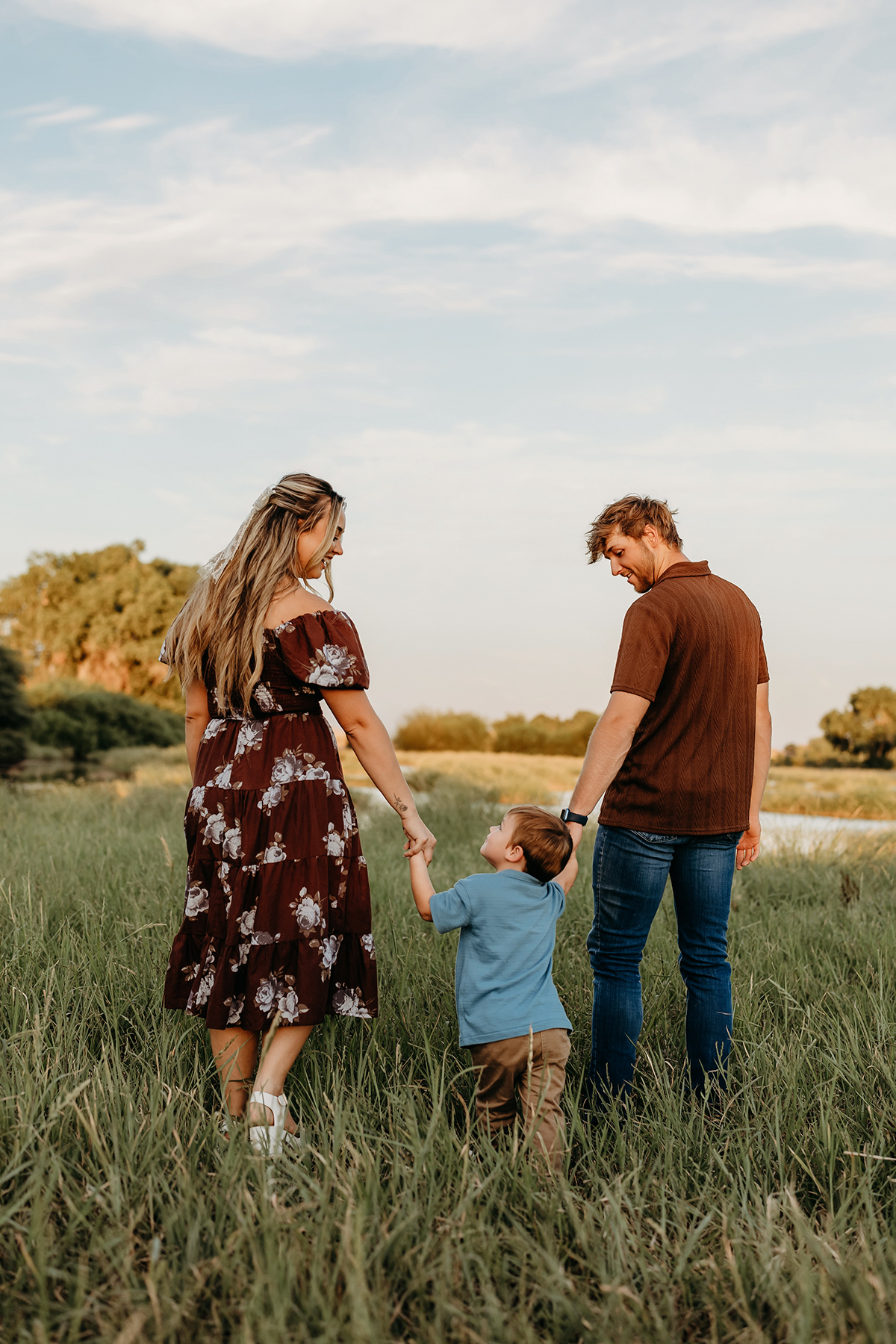 family of 3 wearing chocolate brown + blue in their photoshoot in arizona chandler