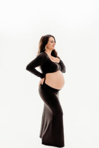 white backdrop black dress maternity photoshoot in arizona